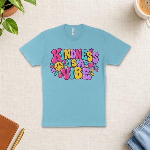 Kindness Is a Vibe | Kindness Tee — styled flat-lay mockup
