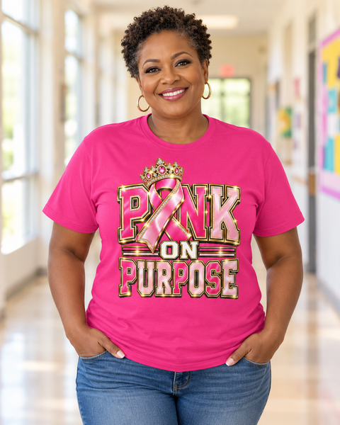 Teacher wearing hot pink PINK ON PURPOSE tee with its jeweled crown and pink ribbon